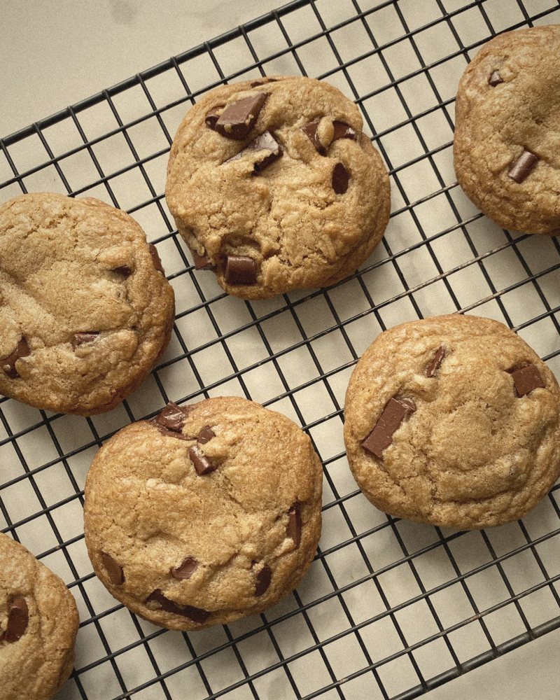Chocolate chip cookies cooling on a rack